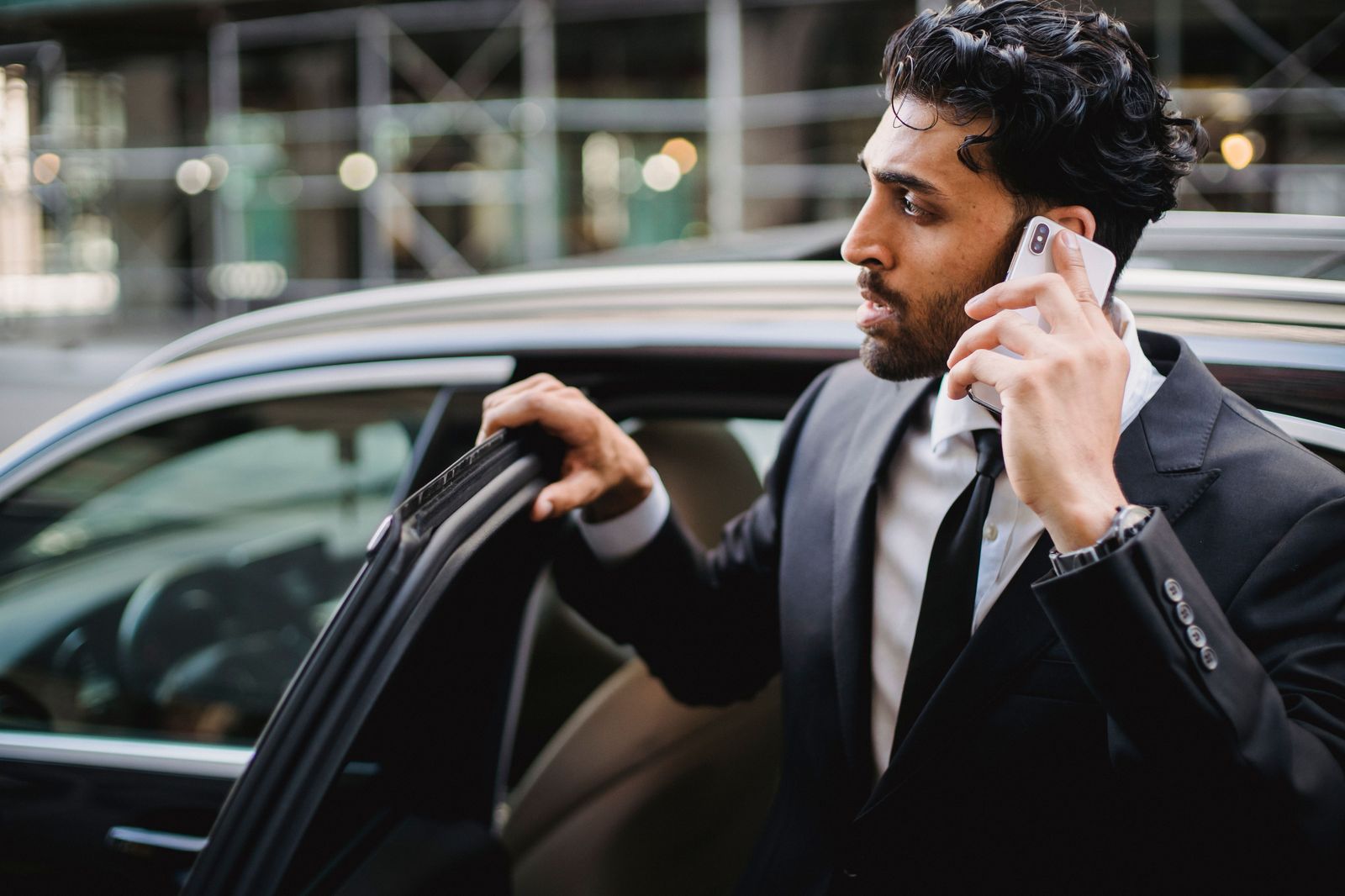 The executive chauffeur service: the door is open before the principal reaches for it