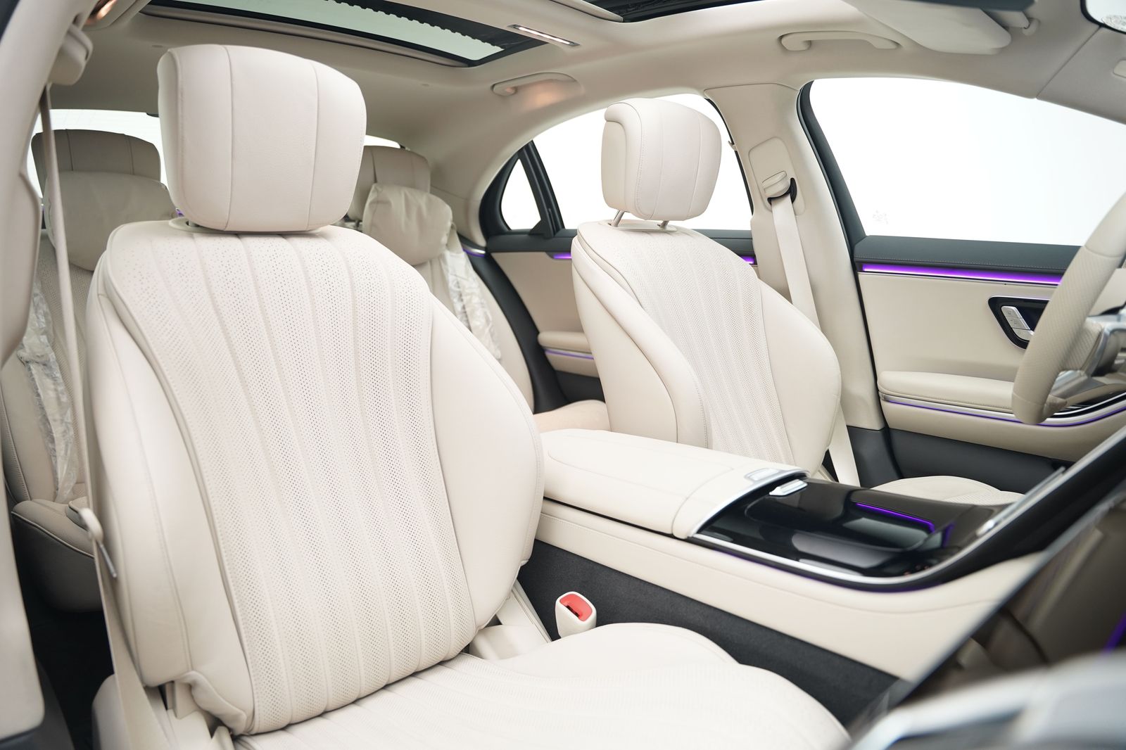 The first-class cabin: rear-seat recline, blinds, silence, and a chauffeur who has rehearsed the day